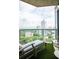 Relaxing balcony offers a lounge chair, a table, and panoramic city views at 2795 Peachtree Ne Rd # 2101, Atlanta, GA 30305