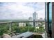 Serene balcony showcasing stylish outdoor seating, a table, and expansive city views at 2795 Peachtree Ne Rd # 2101, Atlanta, GA 30305