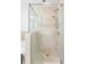 Modern bathroom with seamless glass shower, built-in shower head, and neutral-colored tiling at 2795 Peachtree Ne Rd # 2101, Atlanta, GA 30305