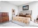 Comfortable bedroom features a stylish upholstered bedframe, dresser, and sophisticated decor at 2795 Peachtree Ne Rd # 2101, Atlanta, GA 30305
