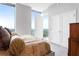 Bright bedroom showcases large windows, natural light, and access to a balcony with scenic views at 2795 Peachtree Ne Rd # 2101, Atlanta, GA 30305