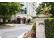 Elegant building entrance with meticulously landscaped grounds and decorative planters, creating a welcoming atmosphere at 2795 Peachtree Ne Rd # 2101, Atlanta, GA 30305