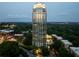 Spectacular exterior shot of high-rise, showcasing its stunning architecture and beautifully landscaped surroundings at twilight at 2795 Peachtree Ne Rd # 2101, Atlanta, GA 30305