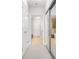 Hallway with a mirrored closet and an opening to the bathroom with glass shower doors at 2795 Peachtree Ne Rd # 2101, Atlanta, GA 30305