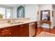 Modern kitchen with granite countertops, stainless steel dishwasher, and dark wood floors and cabinets at 2795 Peachtree Ne Rd # 2101, Atlanta, GA 30305