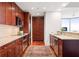 Modern kitchen with stainless steel appliances, granite countertops, and wood cabinetry at 2795 Peachtree Ne Rd # 2101, Atlanta, GA 30305