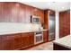 Modern kitchen featuring stainless steel appliances and granite countertops plus rich, dark wood cabinets at 2795 Peachtree Ne Rd # 2101, Atlanta, GA 30305
