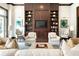 Living room showcasing built-in shelves, large windows, plush seating, and elegant decor at 2795 Peachtree Ne Rd # 2101, Atlanta, GA 30305
