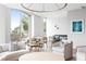 Bright and open lounge space with floor-to-ceiling windows, modern furniture, and elegant lighting fixtures at 2795 Peachtree Ne Rd # 2101, Atlanta, GA 30305