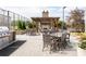 Outdoor patio area featuring a built-in grill, dining tables, fireplace, and pergola at 2795 Peachtree Ne Rd # 2101, Atlanta, GA 30305
