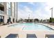 Outdoor pool with sundeck, lounge chairs, and clear blue water with building in background at 2795 Peachtree Ne Rd # 2101, Atlanta, GA 30305