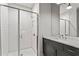 Modern bathroom featuring a sleek vanity with a marble countertop, recessed lighting, and a glass enclosed shower at 3481 Landen Pine Ne Ct, Atlanta, GA 30305