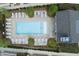 Aerial view of a pristine community pool with ample lounge chairs and manicured landscaping at 3481 Landen Pine Ne Ct, Atlanta, GA 30305