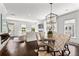Open dining room with hardwood floors, decorative lighting, and views to the front yard and living room at 3481 Landen Pine Ne Ct, Atlanta, GA 30305
