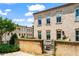 Brick townhouse with well-manicured landscaping and a gated patio area, offering a private outdoor space at 3481 Landen Pine Ne Ct, Atlanta, GA 30305