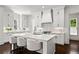 Modern kitchen with white cabinets, subway tile backsplash, large island with seating, and stainless steel appliances at 3481 Landen Pine Ne Ct, Atlanta, GA 30305