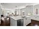 Bright kitchen with a large island, stainless steel appliances, and an open view to the dining room at 3481 Landen Pine Ne Ct, Atlanta, GA 30305