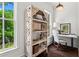 Bright office space with natural light, a decorative bookcase, and a modern desk at 3481 Landen Pine Ne Ct, Atlanta, GA 30305