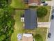 An aerial view shows the house, roof, backyard with gazebo, and surrounding trees and houses at 6378 Grey Fox Way, Riverdale, GA 30296