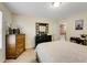 Bedroom with nice natural light, neutral carpet, and dark bedroom furniture at 6378 Grey Fox Way, Riverdale, GA 30296