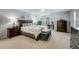 Spacious bedroom featuring a bed, a workspace and a dresser at 6378 Grey Fox Way, Riverdale, GA 30296