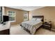 Inviting bedroom with natural light, a comfortable bed, and modern furnishings at 6378 Grey Fox Way, Riverdale, GA 30296
