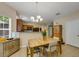 Bright dining room with a chandelier and natural light at 6378 Grey Fox Way, Riverdale, GA 30296