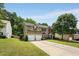 Charming two-story home with a two car garage and well-manicured landscaping at 6378 Grey Fox Way, Riverdale, GA 30296