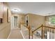 Spacious upstairs hallway with carpet, multiple doors and access to a staircase at 6378 Grey Fox Way, Riverdale, GA 30296