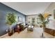 Comfortable living room area featuring a decorative fireplace, stylish furnishings, and plenty of light at 6378 Grey Fox Way, Riverdale, GA 30296