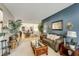 Cozy living room featuring a decorative fireplace, stylish furnishings, and ample natural light at 6378 Grey Fox Way, Riverdale, GA 30296