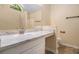 Bathroom with bright natural light, vanity, and large mirror at 115 Manx Dr, Grantville, GA 30220