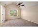 Vaulted ceiling bedroom with carpet, ceiling fan, and natural light at 115 Manx Dr, Grantville, GA 30220