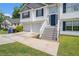 Charming two-story home featuring a two-car garage and a welcoming front entrance with a staircase at 115 Manx Dr, Grantville, GA 30220