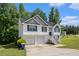 Charming two-story home featuring a two-car garage and a welcoming front entrance with a staircase at 115 Manx Dr, Grantville, GA 30220