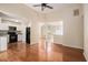 View of open kitchen layout with stainless appliances and hardwood floors at 115 Manx Dr, Grantville, GA 30220