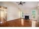 Open living room features hardwood floors, fireplace, and access to a deck at 115 Manx Dr, Grantville, GA 30220