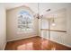 Elegant living room with hardwood floors and large arched window providing natural light at 115 Manx Dr, Grantville, GA 30220