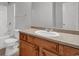 Bathroom featuring a sink with wooden cabinetry and a shower over tub at 4115 Kensington Cv, Atlanta, GA 30349