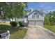 Charming two-story home with a two-car garage and well-manicured lawn at 4115 Kensington Cv, Atlanta, GA 30349