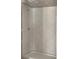 Modern bathroom shower featuring new gray and white hexagon tile, offering a sleek and contemporary design at 7301 Staton Se Pl, Acworth, GA 30102