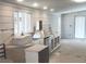 Bright kitchen with stainless steel appliances, farmhouse sink, and natural light streaming in from a window at 7301 Staton Se Pl, Acworth, GA 30102