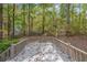 A view of the back deck overlooking a serene and expansive wooded area at 12 Woodland St, Dallas, GA 30157