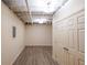 Spacious unfinished basement area with wood-look flooring and visible ceiling at 12 Woodland St, Dallas, GA 30157