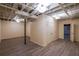 Large unfinished basement area with laminate flooring, drop ceiling, and closet at 12 Woodland St, Dallas, GA 30157
