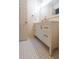 Bright bathroom featuring a stylish vanity with storage and decorative tile flooring at 12 Woodland St, Dallas, GA 30157