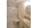 Bathroom featuring stylish marble shower, granite vanity, and modern fixtures at 12 Woodland St, Dallas, GA 30157