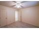 A cozy bedroom with neutral walls, carpet, and ceiling fan provides a calm and relaxing space at 12 Woodland St, Dallas, GA 30157