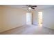 Comfortable bedroom with neutral carpet, a ceiling fan, and access to an ensuite bathroom at 12 Woodland St, Dallas, GA 30157