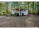 Cozy home featuring a small front porch with natural surroundings at 12 Woodland St, Dallas, GA 30157